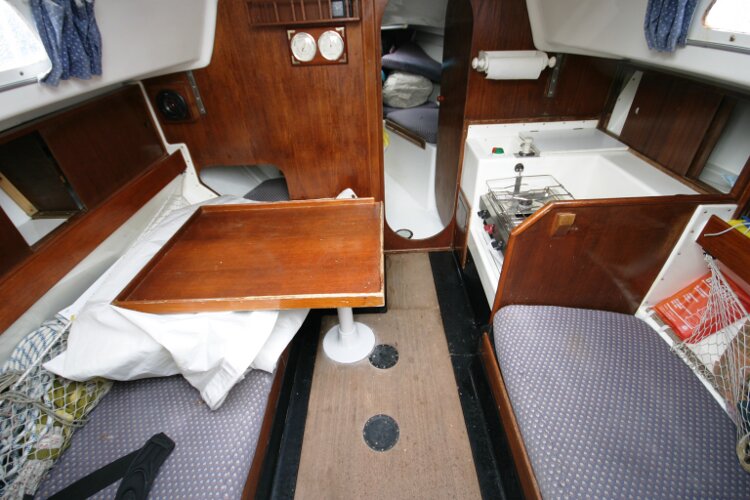 Master Marine Eygthene 24for sale The saloon table - With the galley to starboard