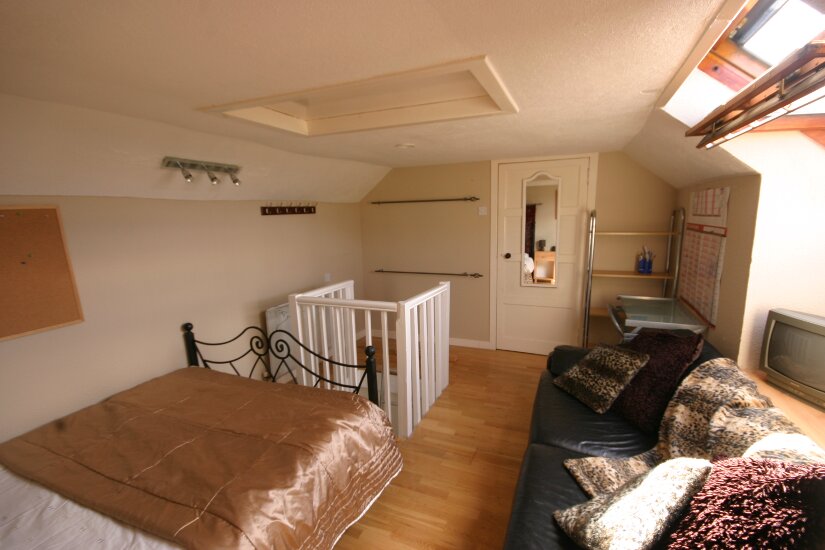 Western Isles Property -  House on the Isle of Lewisfor sale Loft room - Access door to loft storage space at end of room