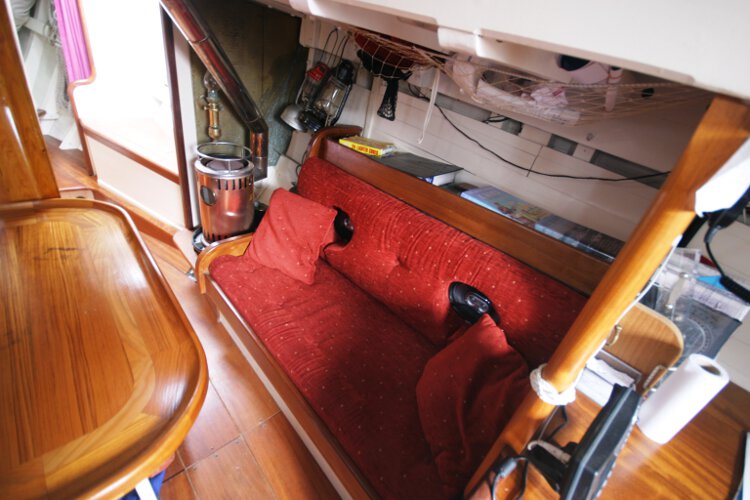 Wooden Classic Gaff cutterfor sale Saloon view - Showing the starboard settee berth, note the stove