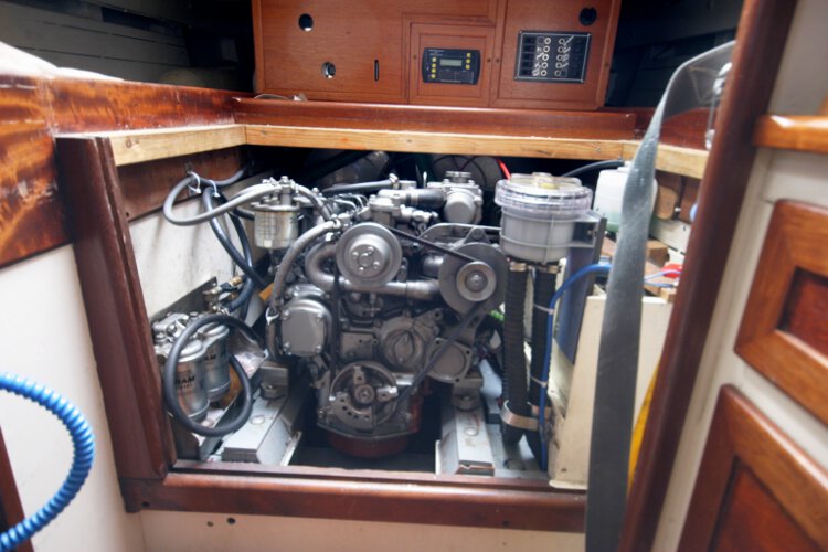 Wooden Classic Gaff cutterfor sale The engine compartment - Located under the companionway,
the engine was installed last year