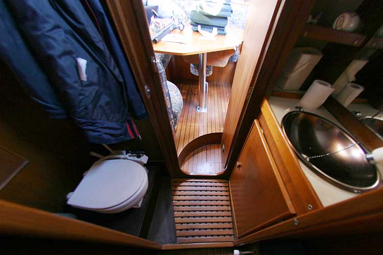 Jeanneau Trinidad 48 Ketchfor sale Heads of the aft port cabin - saloon visible through the door